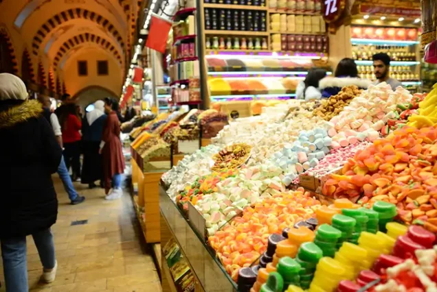 The bustling Habous Market in Casablanca, Morocco, featuring traditional Moroccan shops, artisanal goods, and vibrant local culture within charming, historic surroundings.